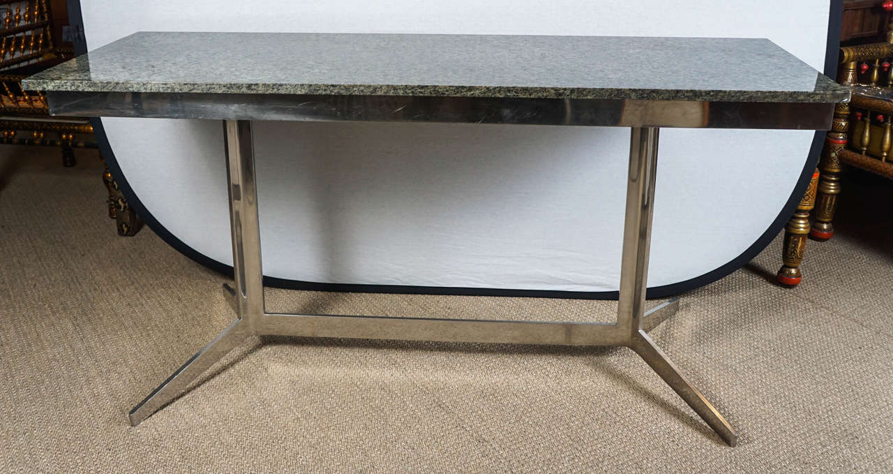 Here is a great pair of granite top consoles with modern chrome bases.
The consoles are available as singles for $2,400 or $4,800. for the pair.