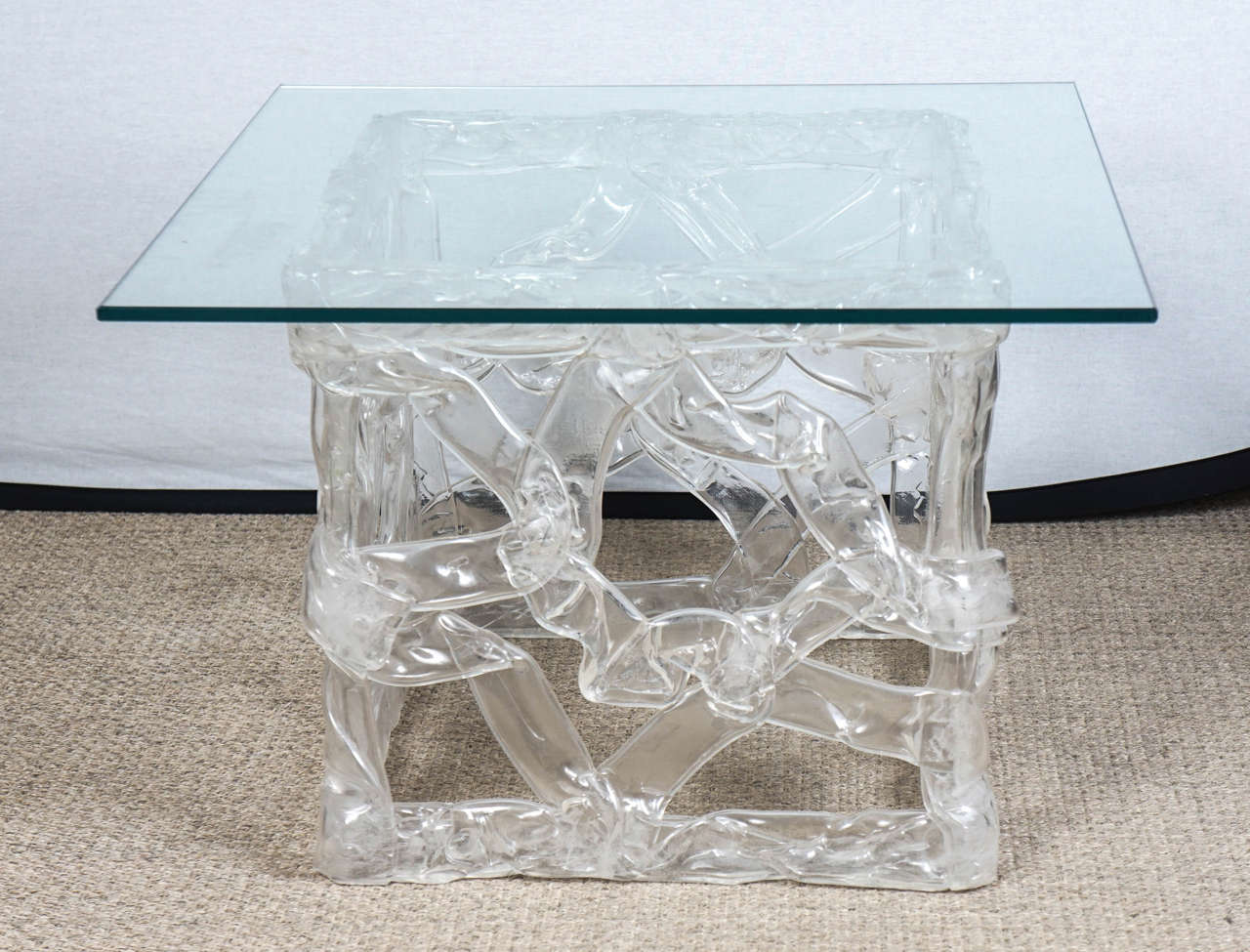 Here is a squared ribbon table in clear Lucite in the style of Tony Duquette.