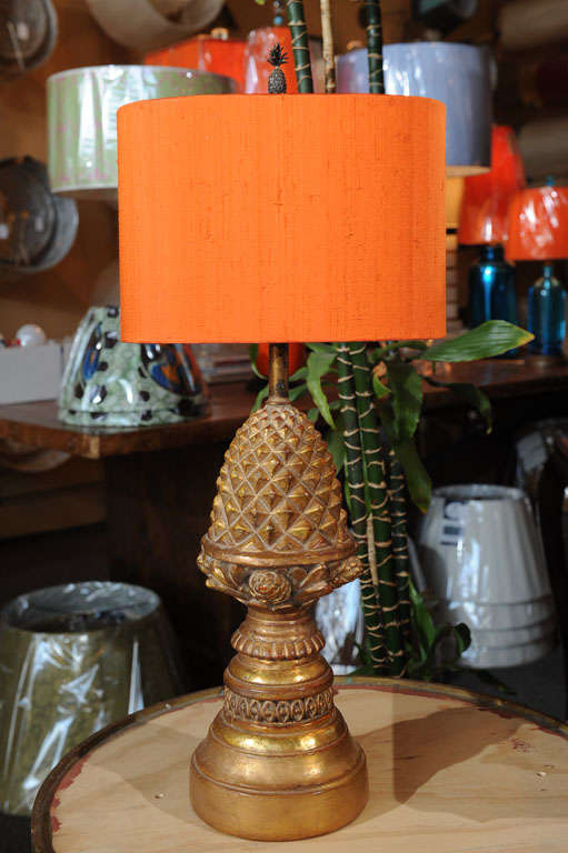 Pair of Borgehese Pineapple lamps in Baroque style, gilded.  Newly wired.  Shade and finial sold separately.