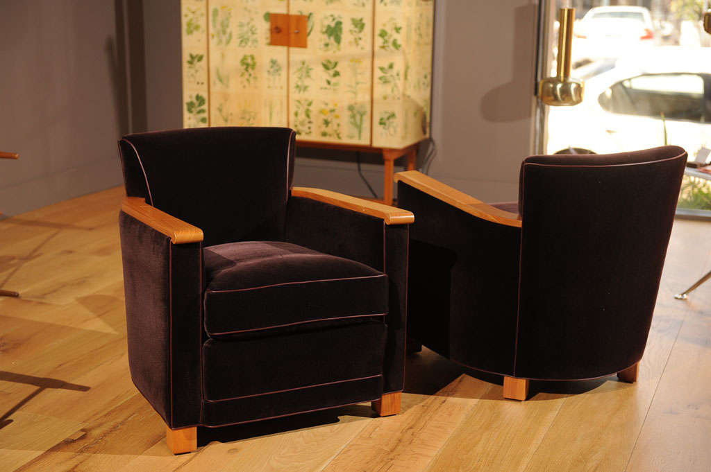 A pair of chairs by Jacques Adnet newly restored with Mohair upholstery and leather piping. Priced per chair.