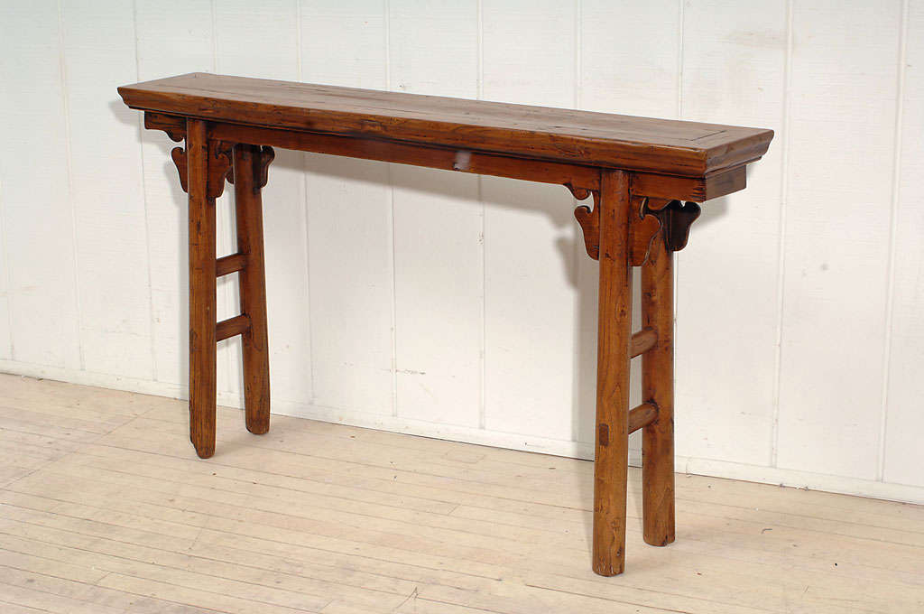 Small Flat Top Altar Table with cloud carved spandrels and round legs. A warm, mellow patina enhances the cedar wood.
