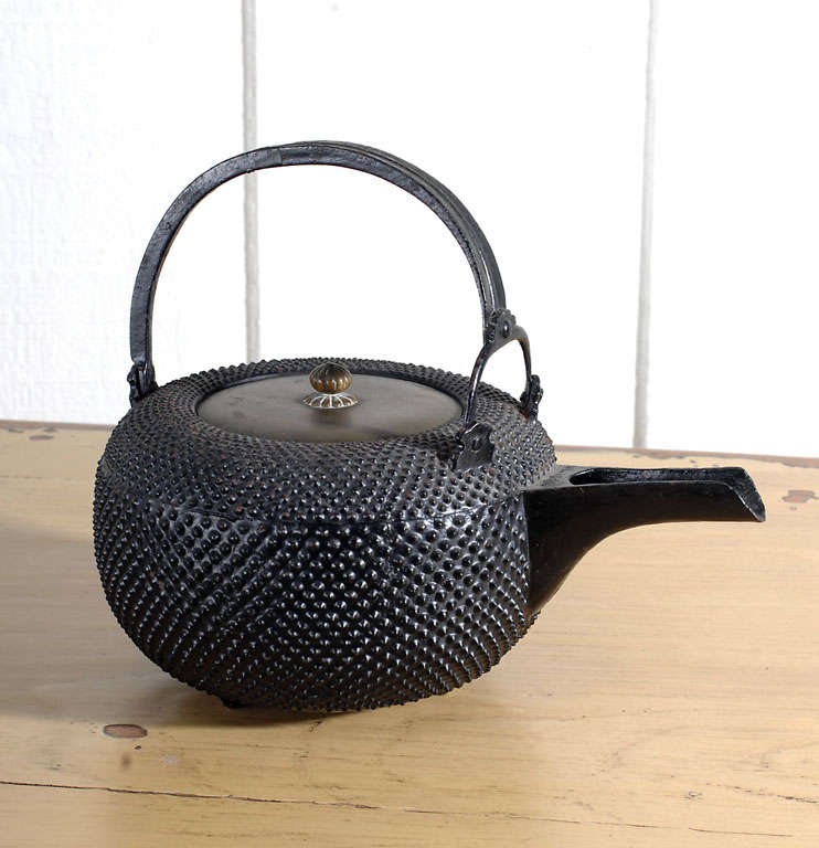 Blackened Cast Iron Japenese Teapot from the Meiji Period (1867-1911). Brass lid with pewter interior.