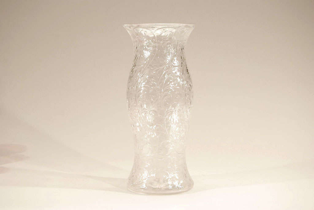 This fabulous hand blown crystal shape appears to be a hurricane but in fact is a tall and elegant vase. Completely wheel cut all over in an Art Nouveau floral motif with undulating leaves and garlands. It is heavy and well balanced and would lend