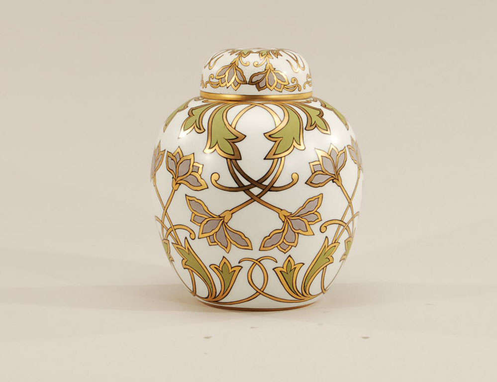 Beautiful porcelain covered vase in the classical Chinese ginger jar form. All-over decorated in Arts & Crafts style polychrome enamels with gilding and a matte ground.