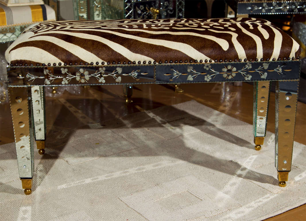 Hand-made bench, seat covered in genuine vintage zebra hide, frame covered in hand-etched clear venetian glass.