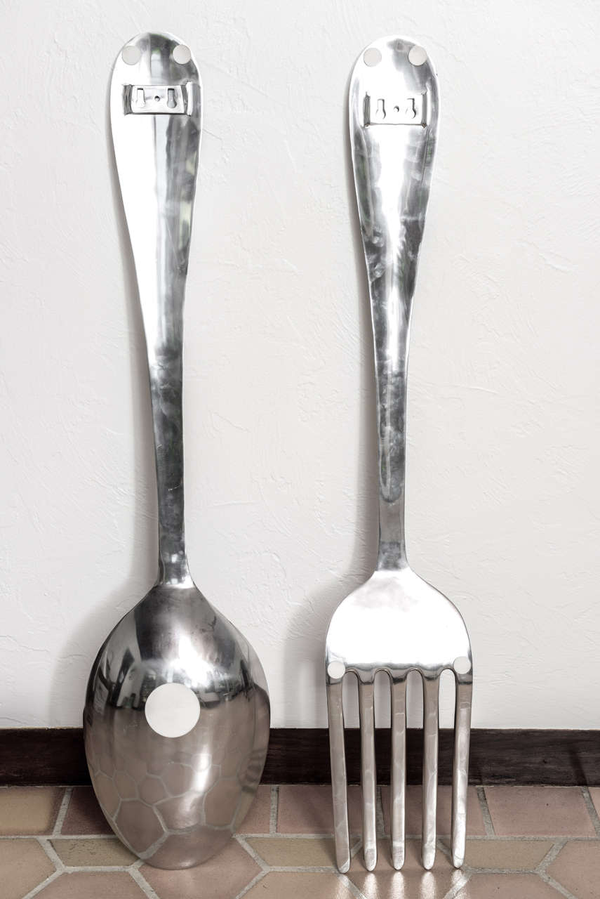 Large aluminum wall hanging kitchen utensils.  Spoon measures 46.63