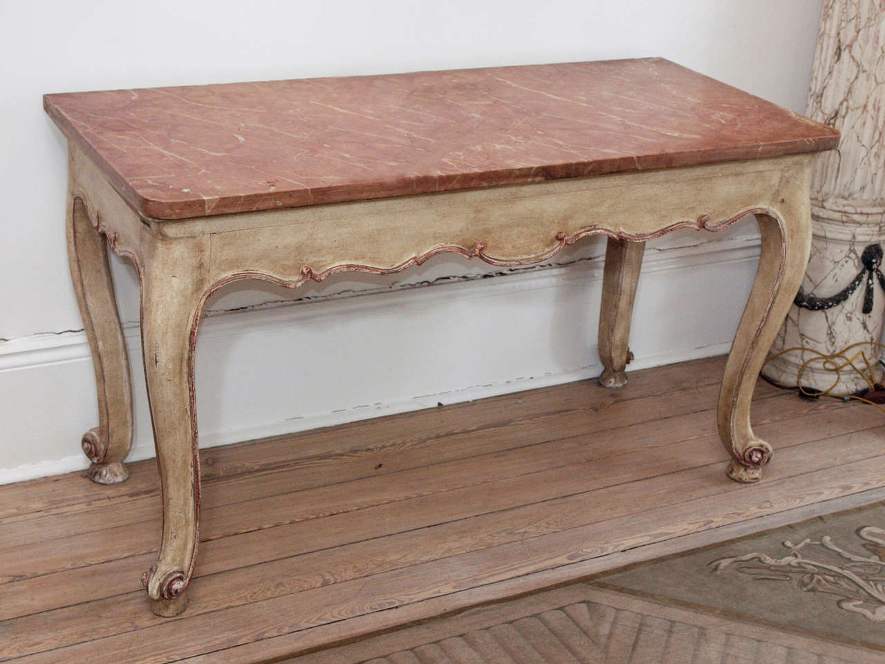 Beautiful Louis XV style marble console with wooden base. 
Pale, antique grain, gold edge finish. 