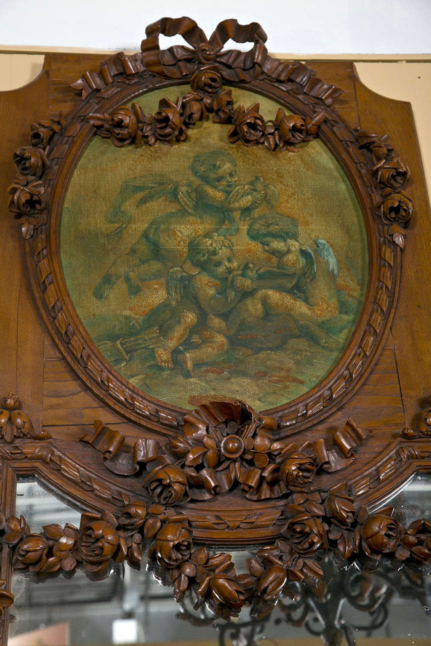 A French carved trumeau wall mirror.