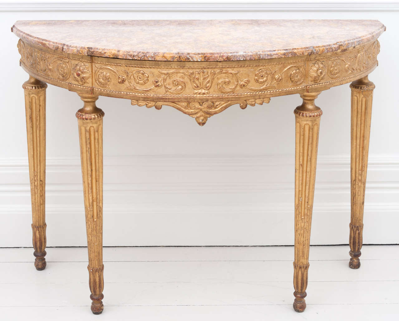 A very fine and impressive 18th c. Italian demi-lune table with original Spanish brocatelle marble top. The colour and condition of the gilding and table is excellent.