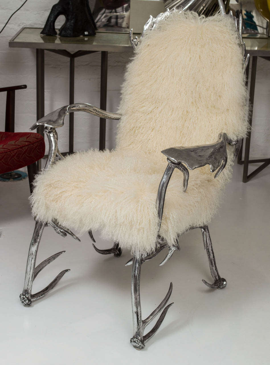 Polished Arthur Court antler chair upholstered in Mongolian wool.