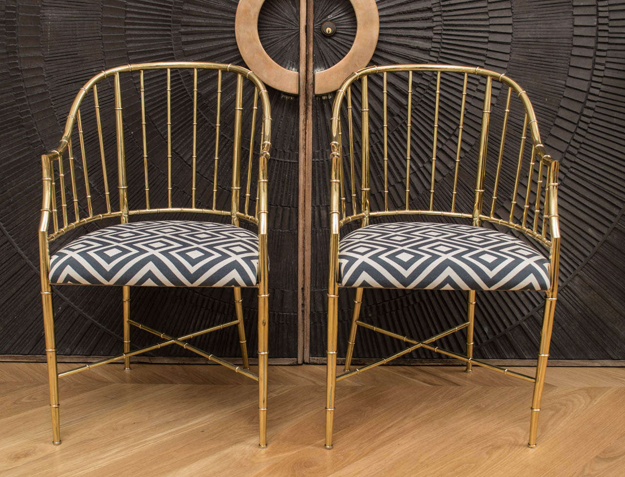 Pair of polished brass Mastercraft chairs.