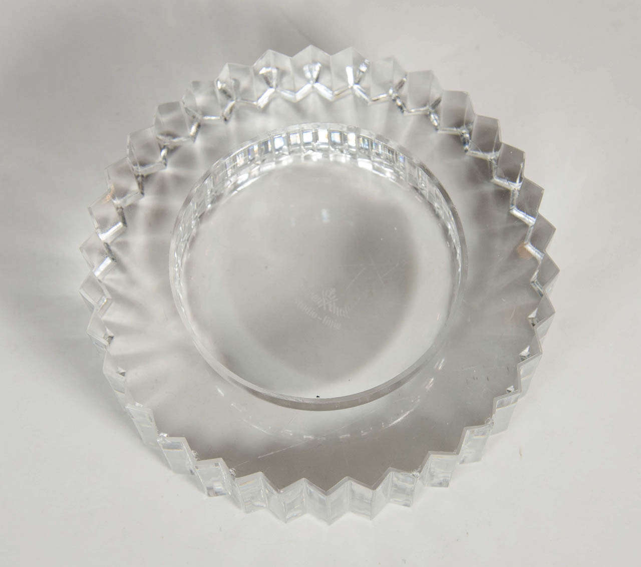 This cut crystal tray has a great modernist gear design and is signed Rosenthal on the bottom. This would be great as a ring /jewelry holder or just as a chic decorative object.