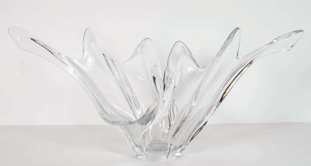This gorgeous hand blown crystal bowl has a stylized wave/splash design and it is signed on the bottom 