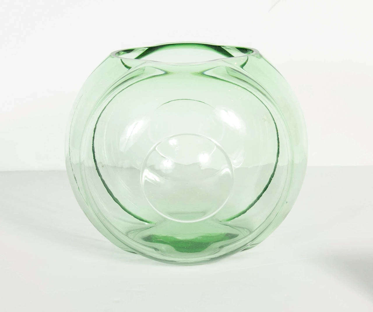 This stunning glass vase features Tiers of concentric circular designs. This vase is documented by one of the foremost Art Deco glass designers in America.