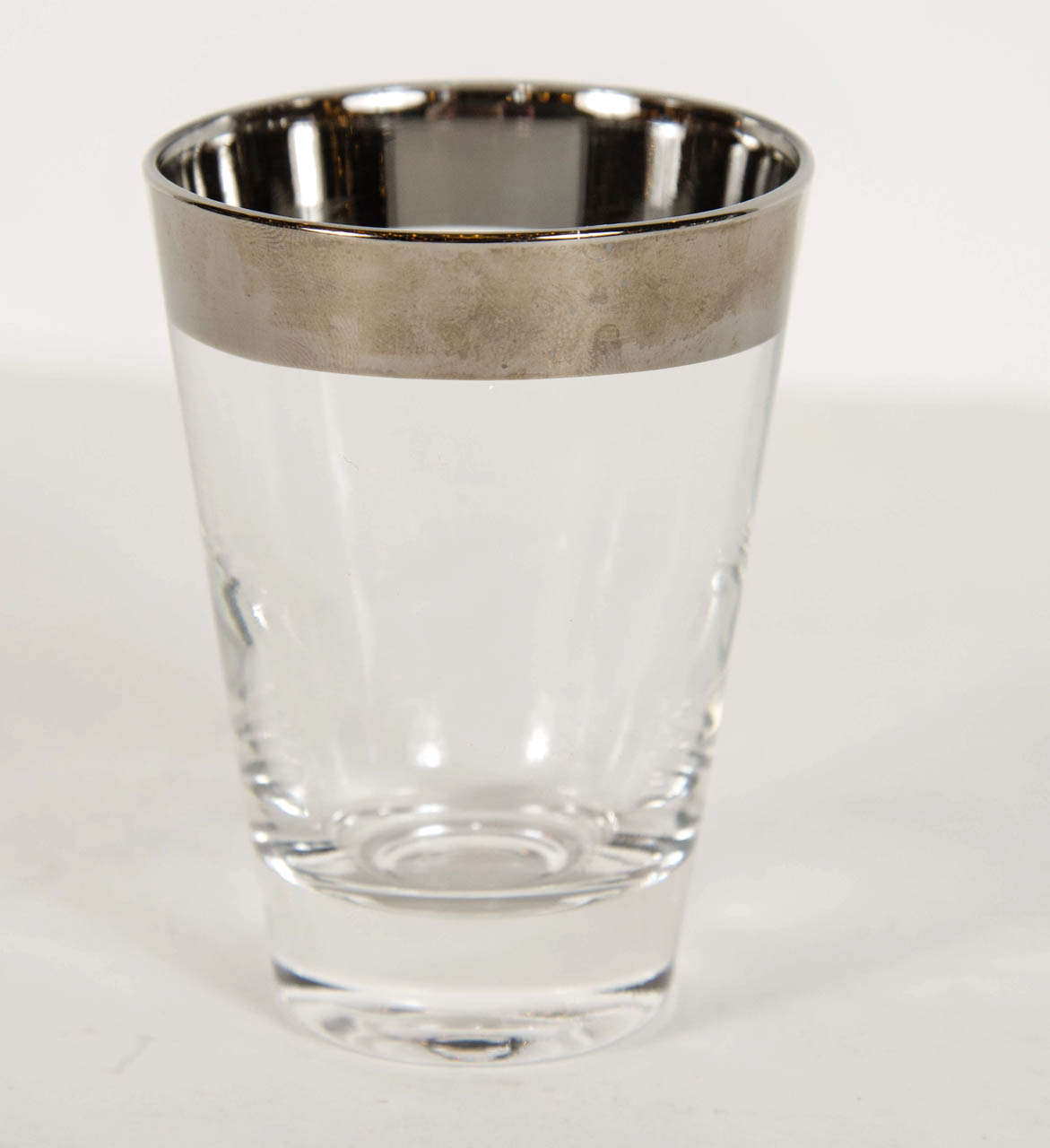 Set of 4 tumblers in hand blown glass with sterling bands on the top.