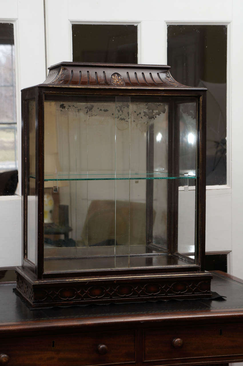 Small George III style Mahogany vitrine cabinet with sliding glass doors and one shelf. Mirror backed.
Could be wall-mounted.