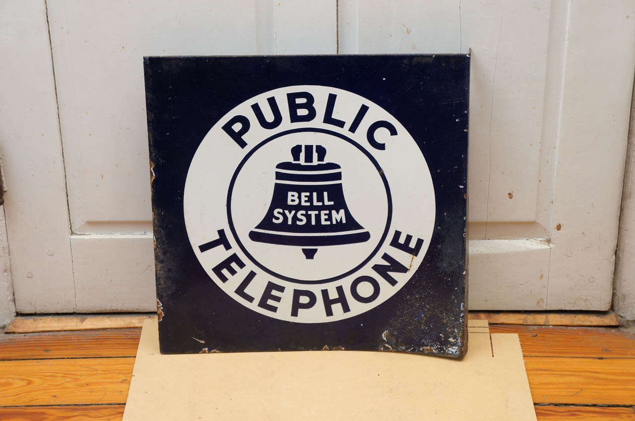 Steel blue and white bell system telephone sign. Used to indicate a public
phone or phone booth. Double-sided. 2