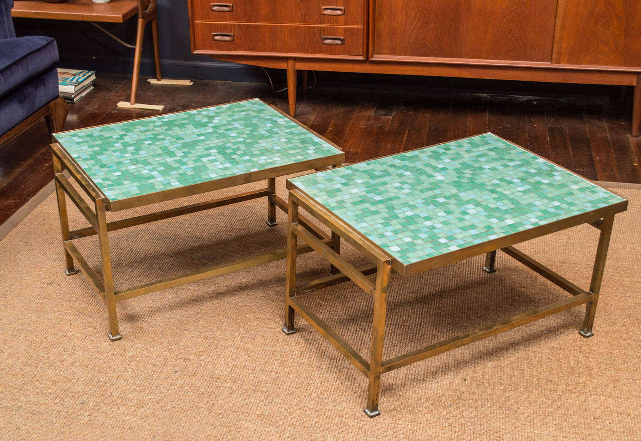 Rare design tables by Edward Wormley for Dunbar. Aqua colored Italian glass mosaic tops inset in patinated brass frames.
Model #5426 original matched pair, excellent original condition.