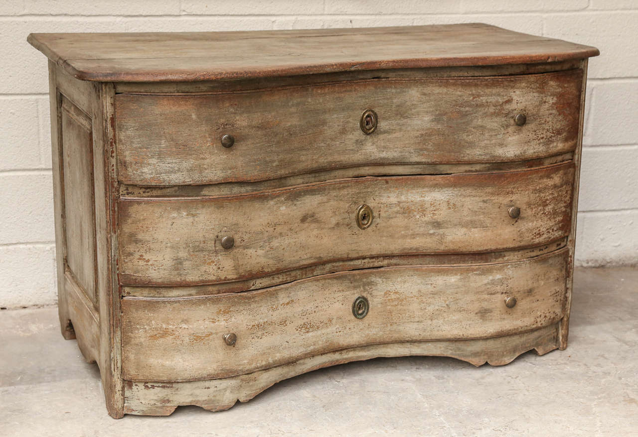 Very handsome 18th century French serpentine commode with three drawers and beautiful shape. The breathtaking patina on this piece will make any home happy!