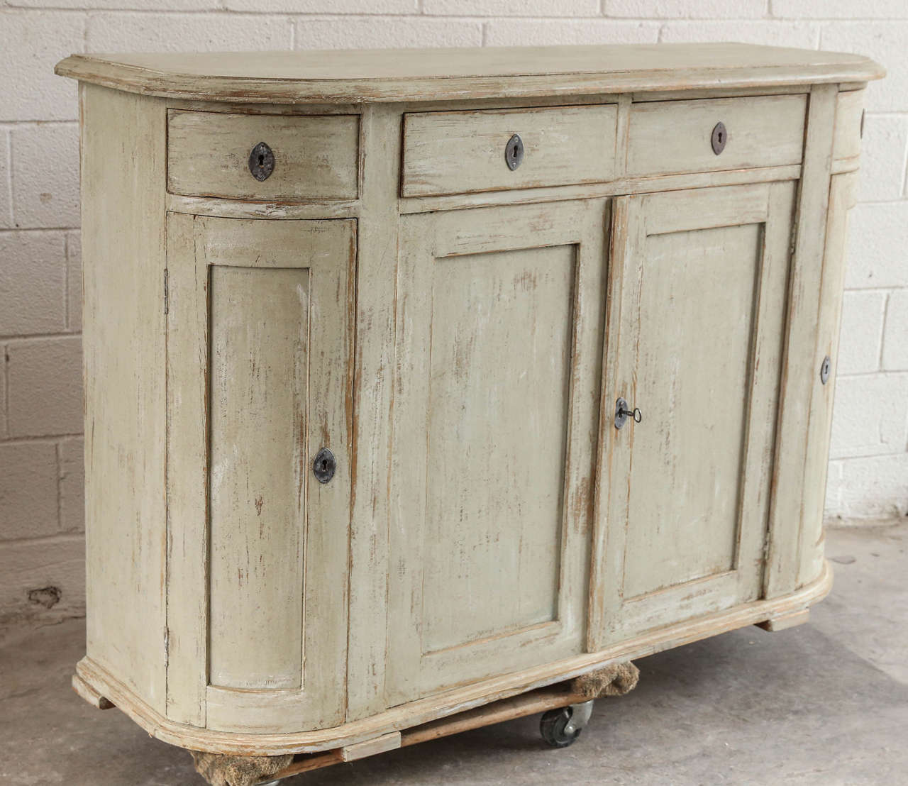 Swedish Gustavian Style curved buffet with four drawers and four doors.