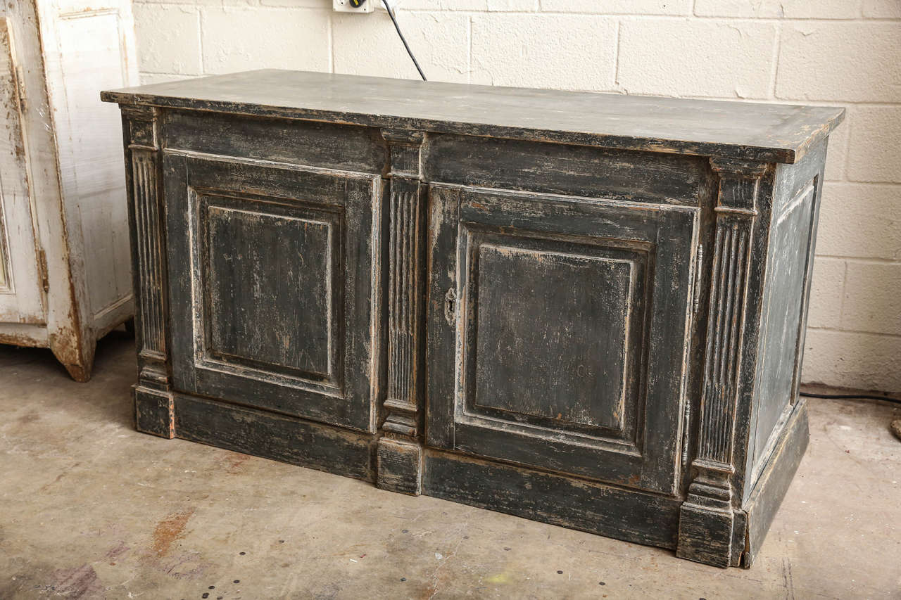 Handsome French 19th century painted buffet flanked by carved columns in a deep greyed blue. (Only one available).