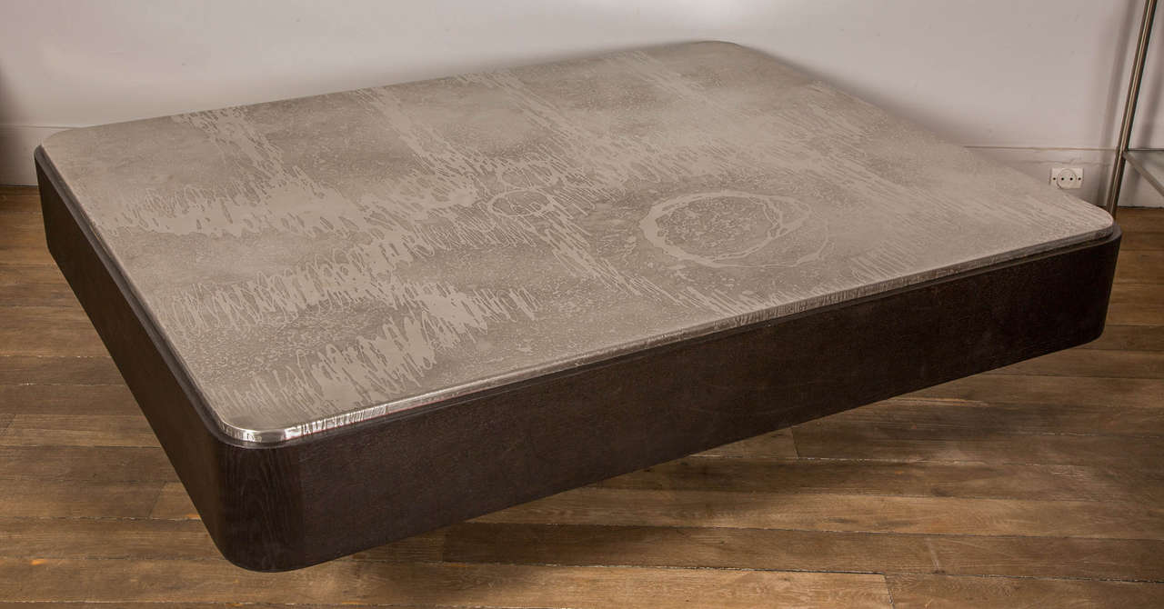 A large coffee table, acid etched steel top and ebonized oak sides.
Belgium, Circa 1970.