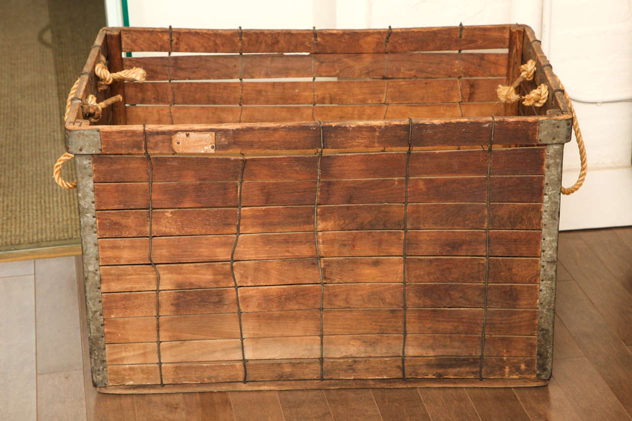 Wooden slate bin with rope handles, circa 1930.