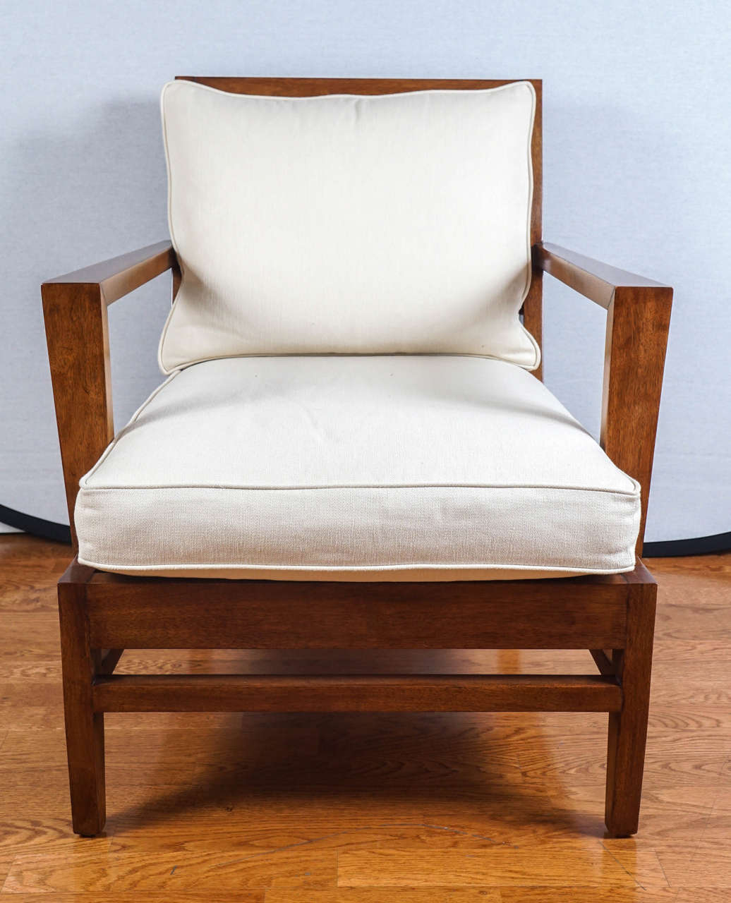 lounge chair with removable ivory linen, box edged cushions.
quite handsome, with clean, simple lines.