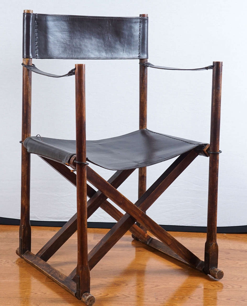 handsome, black stitched leather, campaign style chair.
folds up nicely, to a convenient, 5