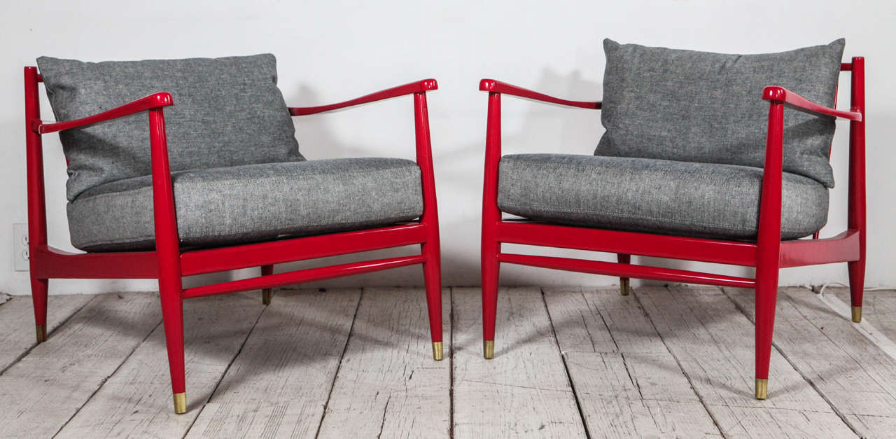 Vintage lounge chairs newly lacquered in imperial red and upholstered in a reverse denim.