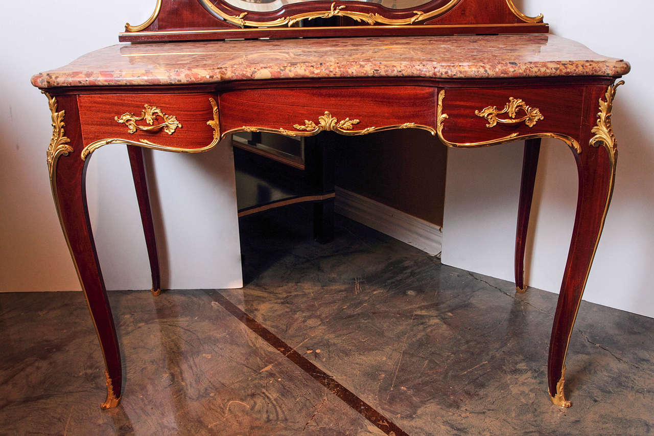 19th century French Louis XV  mahogany and gilt bronze dressing table. Rare signed  F Linke  marble top dressing table with a mirror on top.