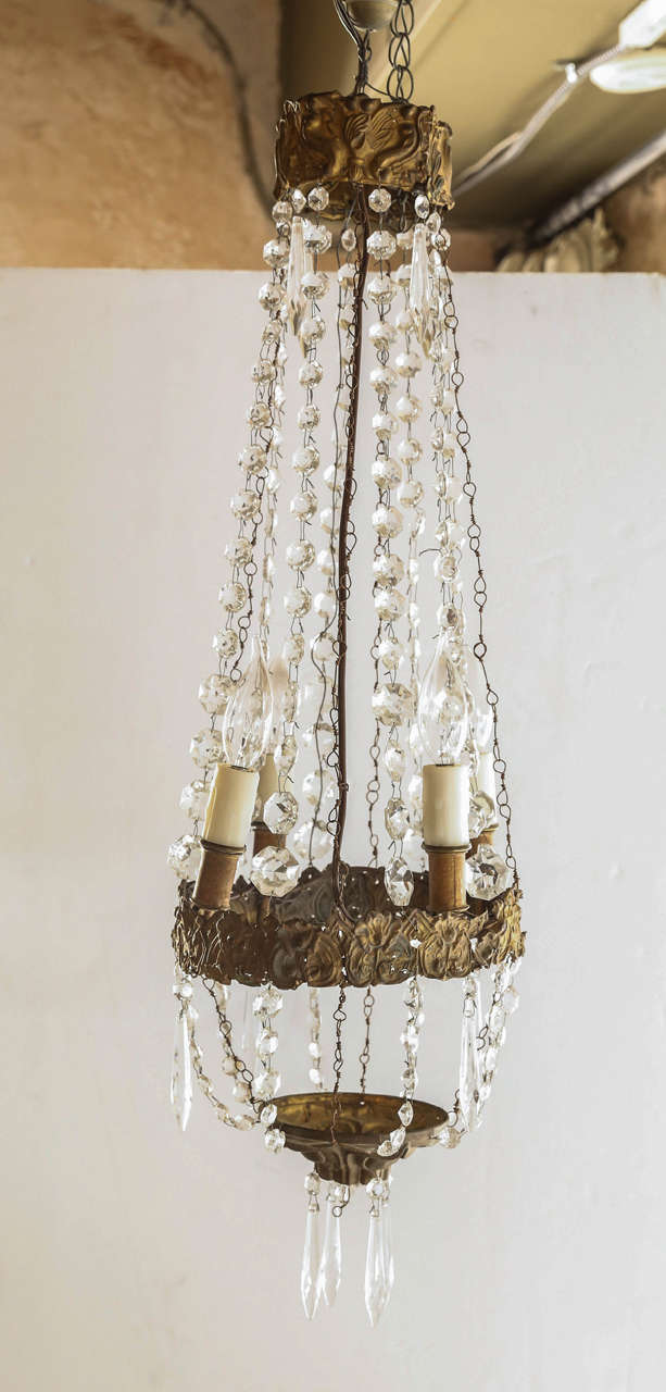 Small Italian chandelier in patterned tole and crystal. Original chain. Has been wired for the USA. Two chandelier available at $3200. each.