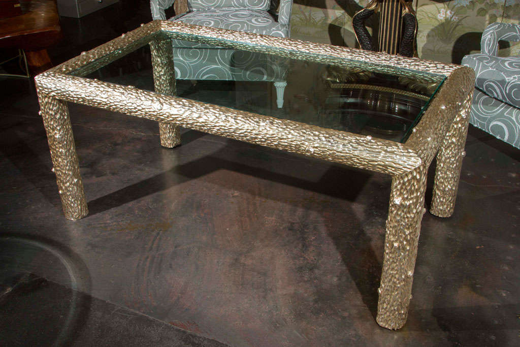 A gorgeous real white gold leaf faux bois table. Deeply carved wood detailing a knobby tree trunk. New glass top. This table can also be used as a coffee table and price includes cutting down the legs to coffee table height per client's requirements.