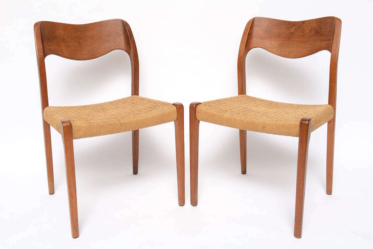 Beautiful woven seats and modeled backs these Teak beauties by Moeller will enhance any dining room.