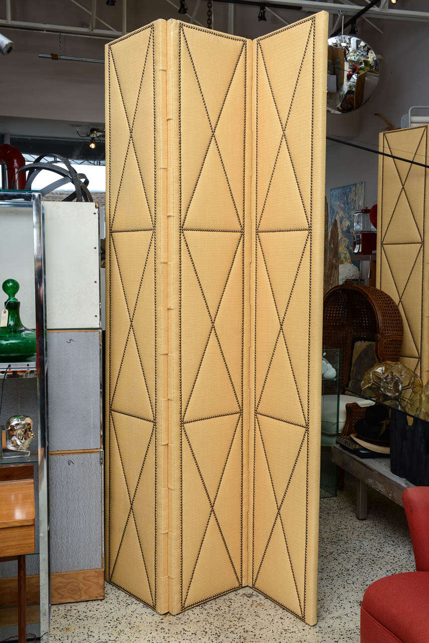Pair of very tall 3-panel  dividers in raffia with studs. Back and front identical.