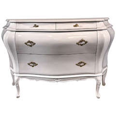 A Bombe White Lacquered Commode