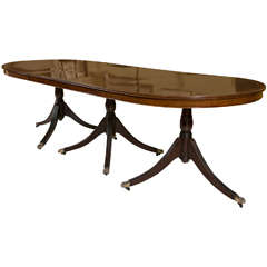 An English Georgian Style Triple Pedestal Banded Mahogany Dining Table