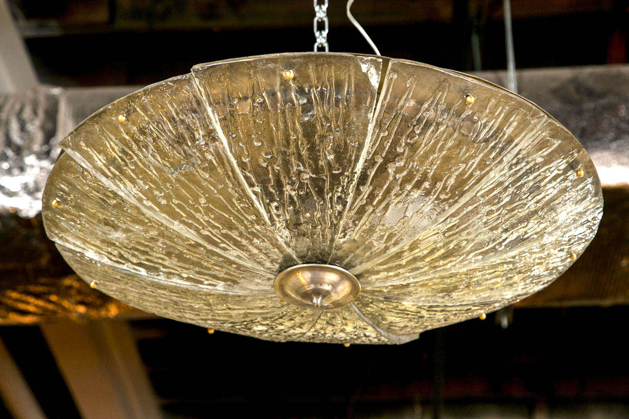 An Art Deco hanging light fixture easily ceiling mountable in the Lalique fashion. The ten panel triangular frosted glass panes done in the Lalique manner supported by an interior structure. The whole can easily be flush mounted to the celling or