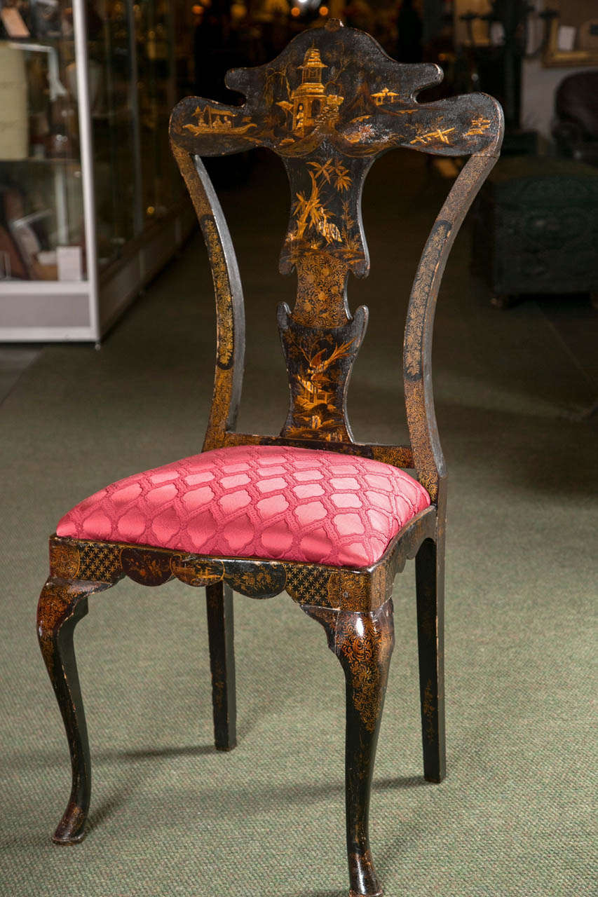 A Queen Anne style side chair decorated with black lacquer and chinoiserie painting.