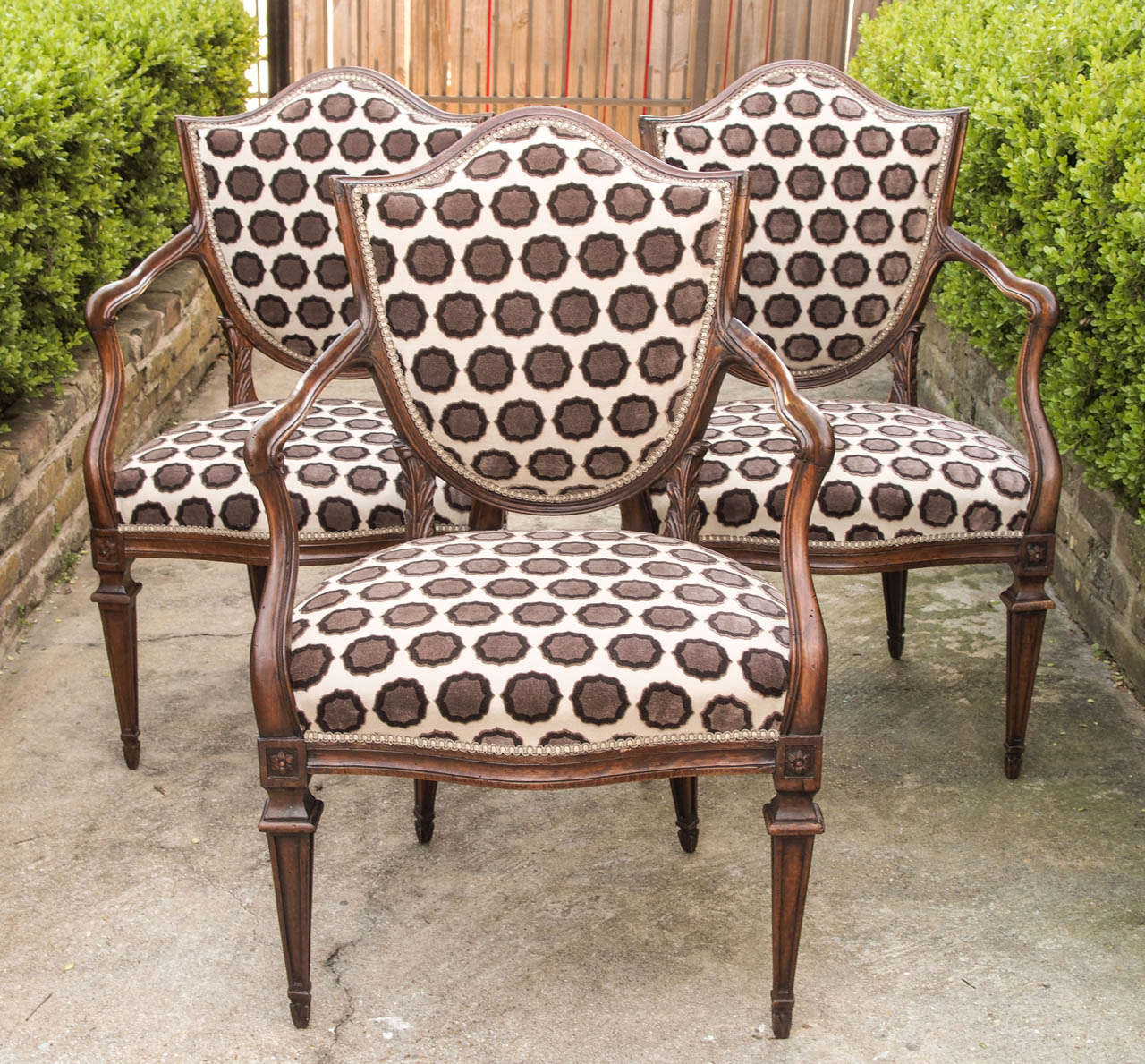 Set of Nine Italian Shield back Walnut Armchairs with contemporary upholstery