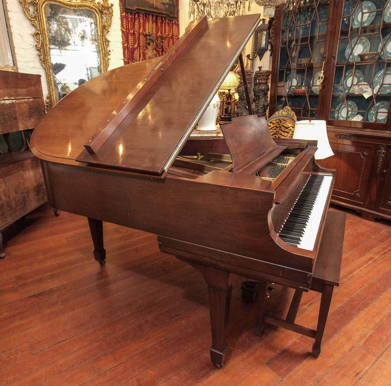 Steinway Model M Mahogany Grand Piano 1918 serial No. 192788 
This piano was totally overhauled in the 1980's according to verbal from the previous owner. We have had two strings replaced. Plays well and holds tune well. The case has some slight