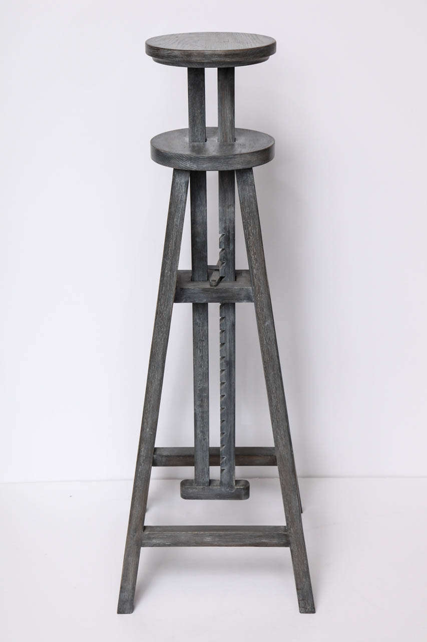Adjustable height cerused wood sculpture stand.

Height when fully extended: 61.5