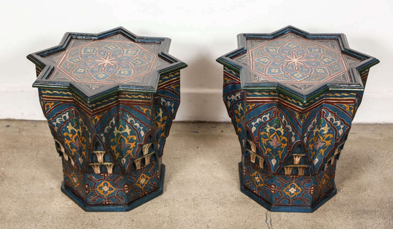Moroccan colorful blue hand-painted and carved side occasional table with Moorish designs.Blue background with multicolored floral and geometric designs. Very decorative fine artwork on a star shape base. You can use them as night stand or side