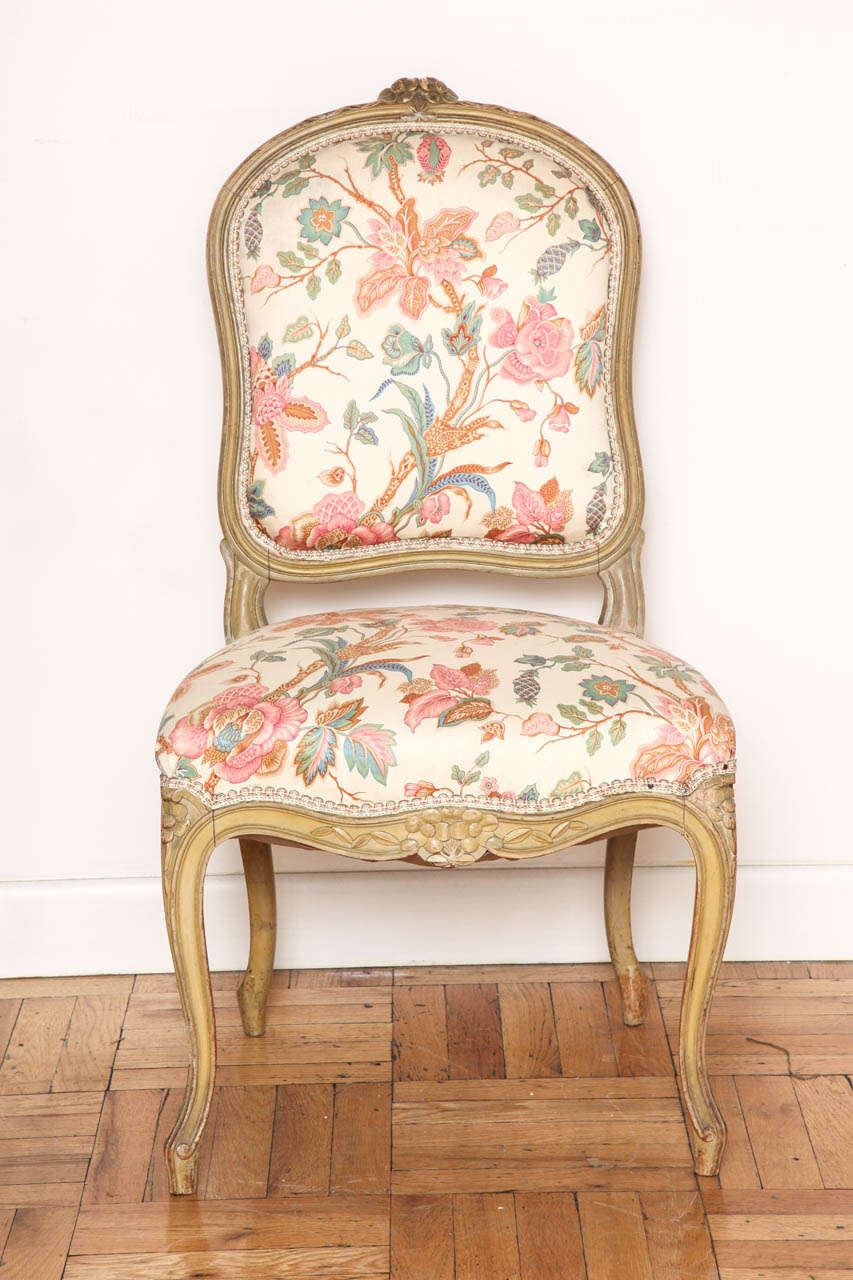 A set of Louis XV style carved and painted dining chairs, France, circa 1940.