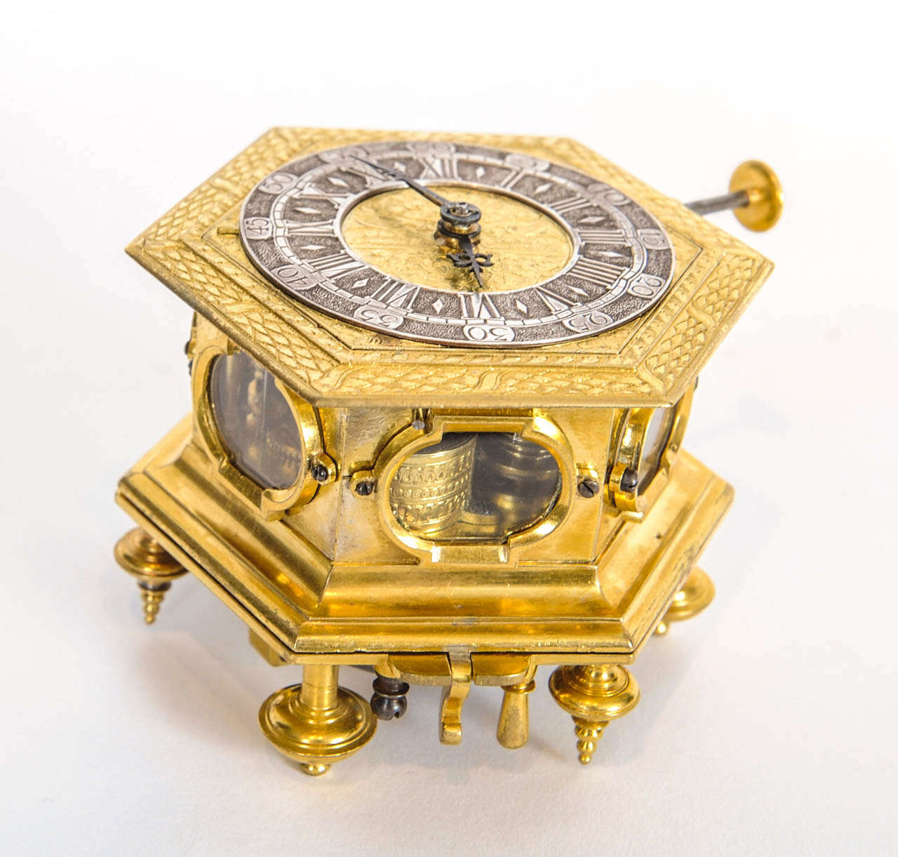 A small and early German brass hexagonal horizontal table clock, circa 1680