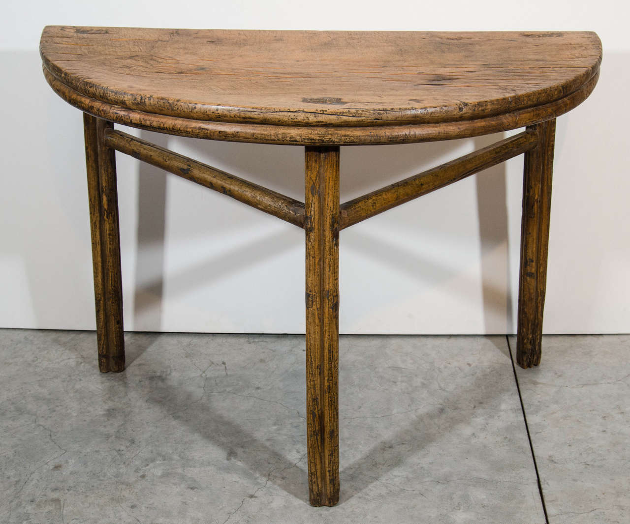 A nicely detailed and handsomely weathered antique poplar wood low Chinese half moon table.
From Shanxi Province, circa 1880.
T413.