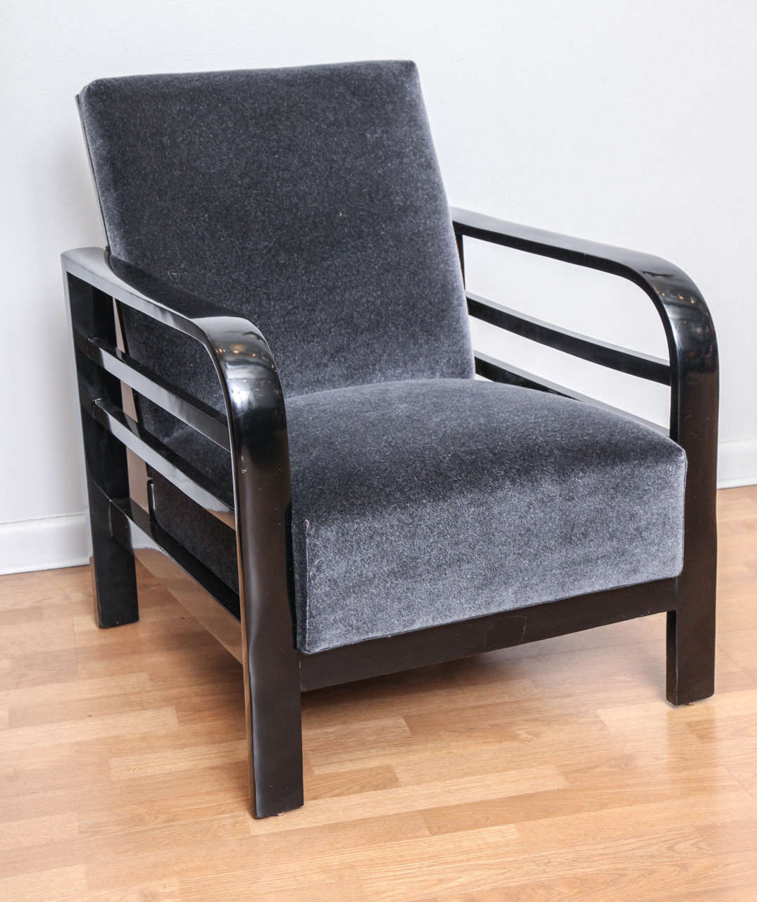 A pair of Bauhaus armchairs. Black lacquer. Newly upholstered in grey or black mohair.