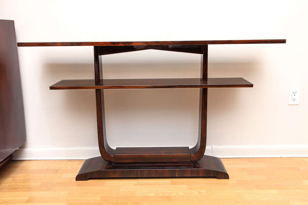 An Art Deco console table with shelves. Palissandre wood.