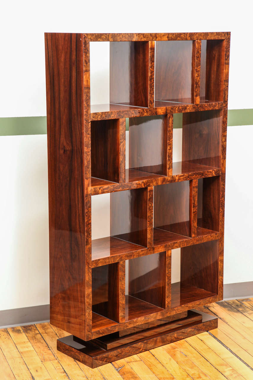 A modernist bookcase. Rare pair available; priced individually. Northern walnut and walnut root.