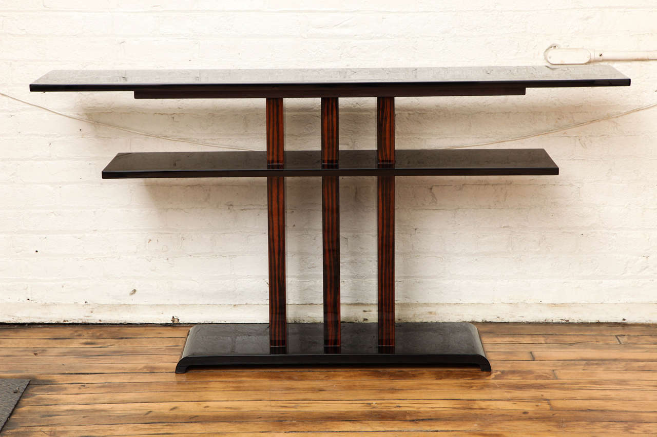 An Art Deco console or sofa table. Black lacquer and Macassar ebony.